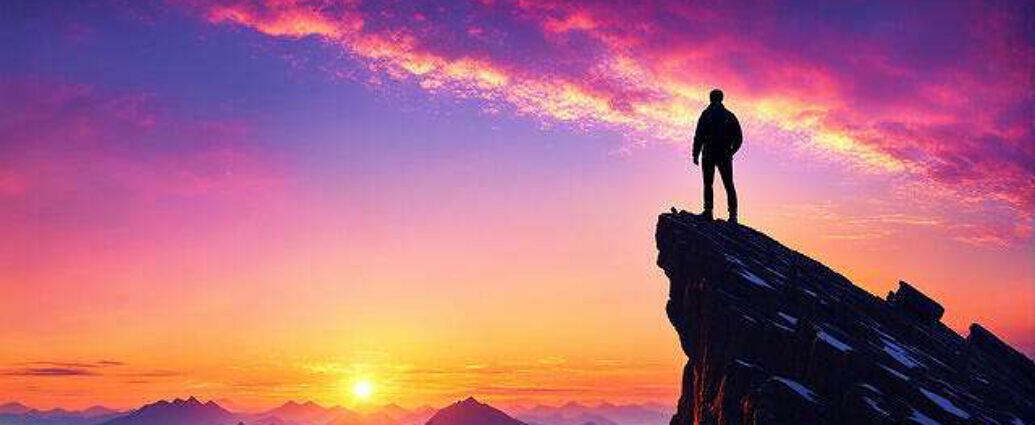 Young Man Atop A Mountain Peak Silhouetted Against A Vibrant Sunrise Observing His Dreams Material (2)